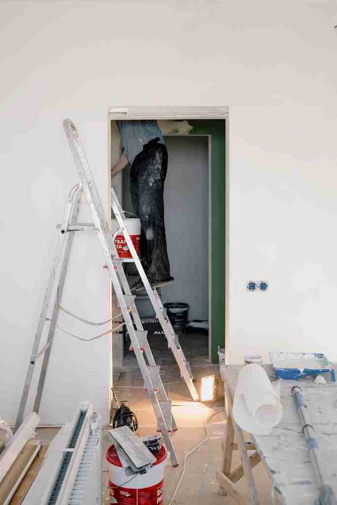 Crop man doing renovation in room -home services professional